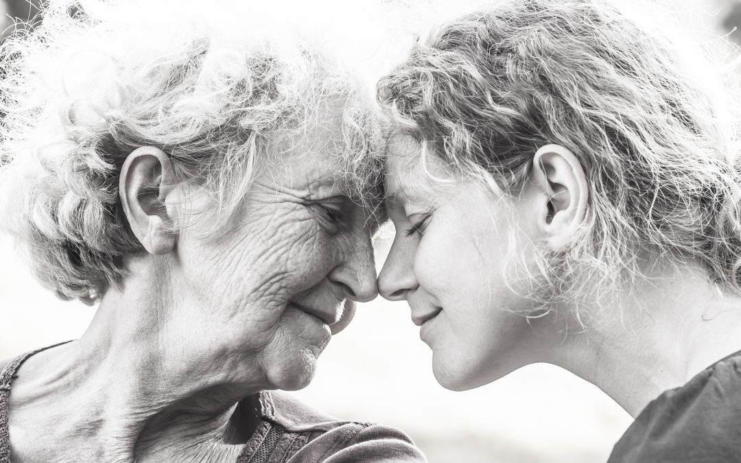 Elderly mother and daughter face to face